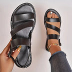 Flat sandals with open back and buckle decoration