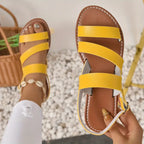 Flat sandals with open back and buckle decoration