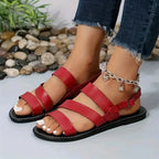Flat sandals with open back and buckle decoration